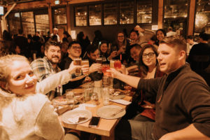 group of people toasting at table